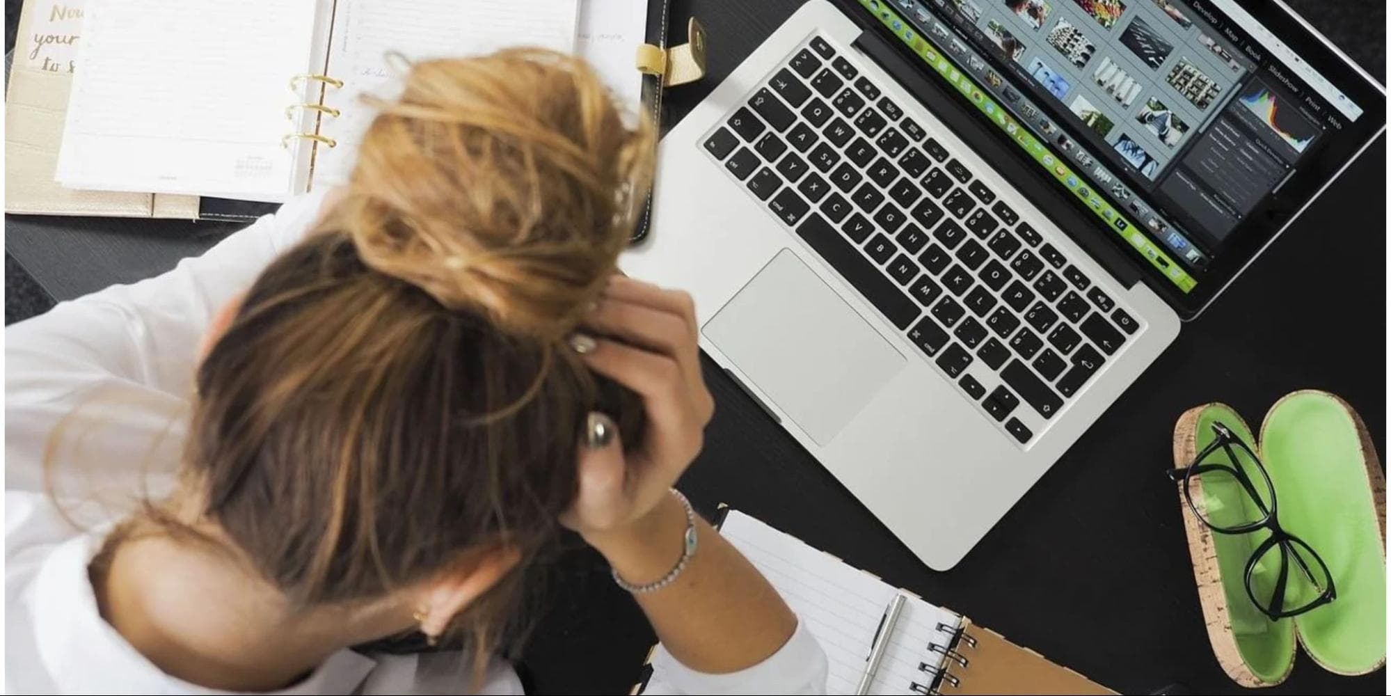 Stressed teacher with marking papers